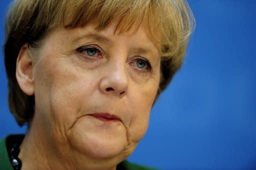 German Chancellor Angela Merkel attends a press conference in Berlin. European and world leaders have reached out to president-elect Francois Hollande, France's first Socialist head of state in 17 years, despite jitters about his pledge to renegotiate Europe's austerity pact