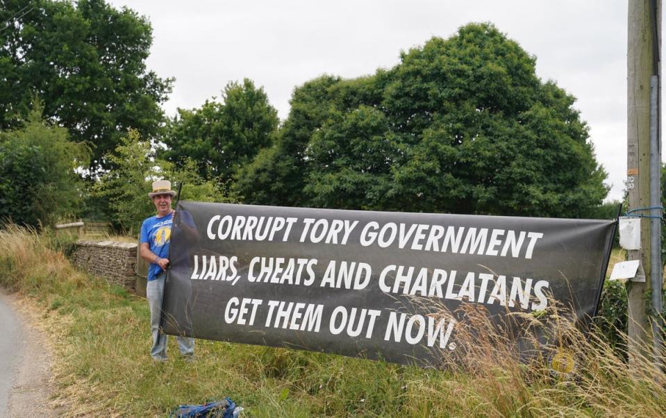 Brexit protester Steve Bray was spotted with an anti-Tory banner outside the venue (PA)