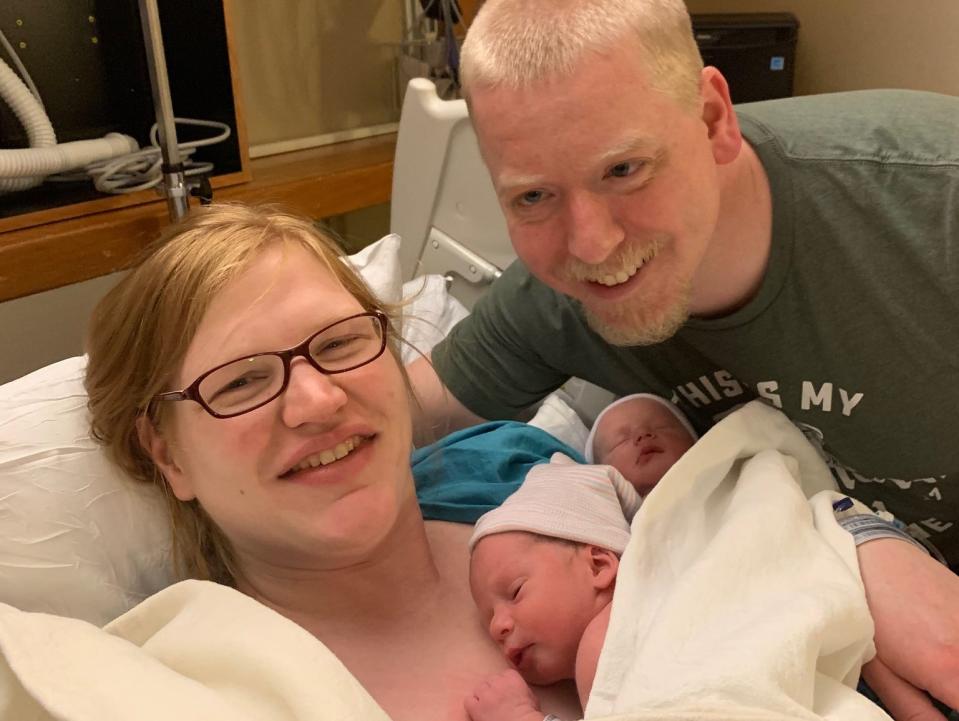 Married couple Rachel and Philip Ridgeway shown in the hospital with their newborn twins