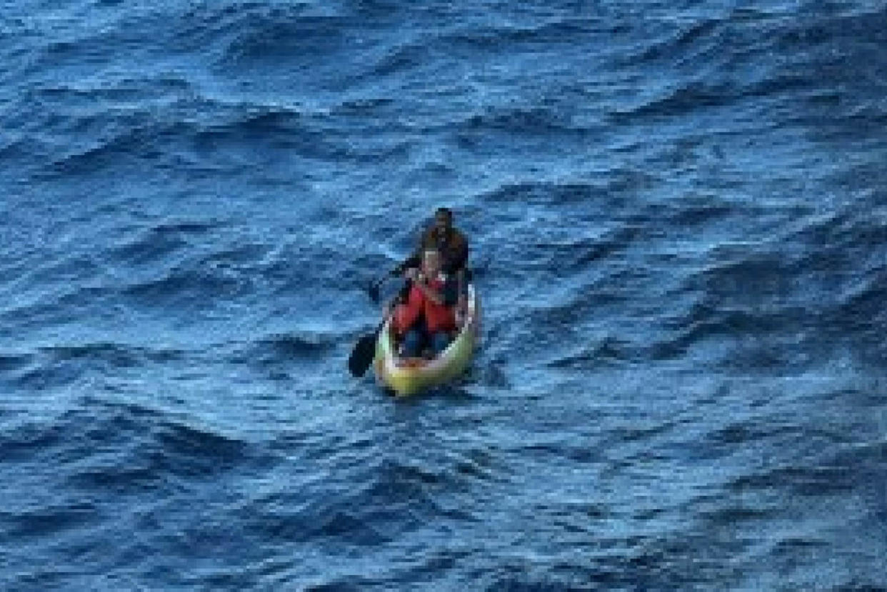 The two stranded men on a kayak before being rescued. (Carnival)