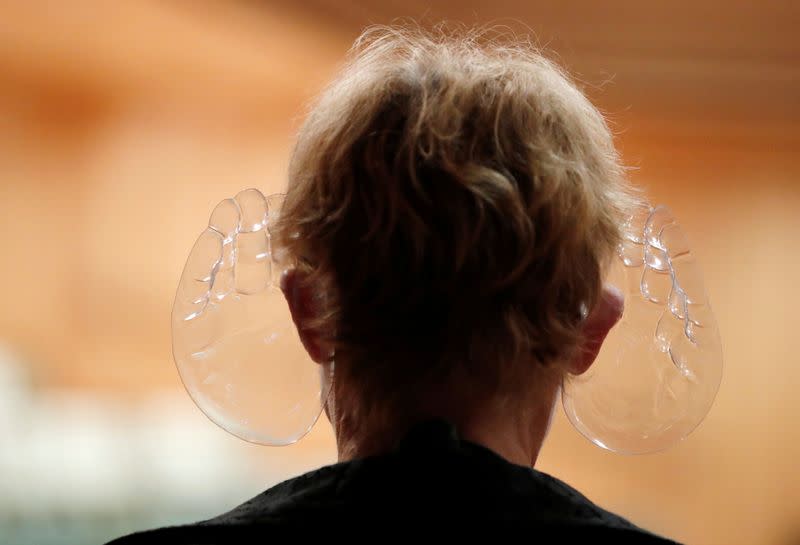 A woman wears Ivan Fischer's acoustic mask at the Mupa Budapest