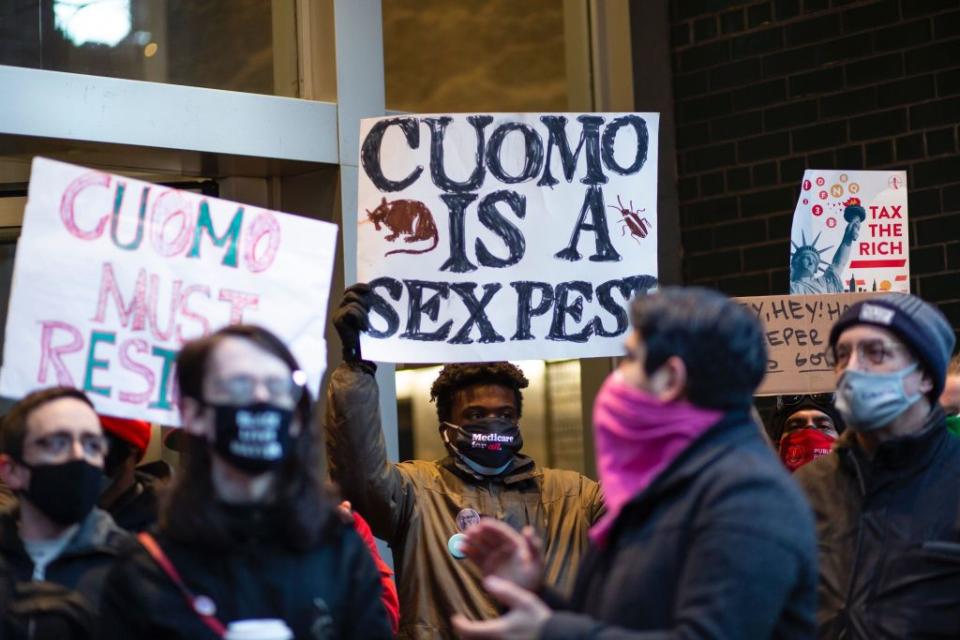 People attend a protest to demand New York Governor Andrew Cuomo's resignation.