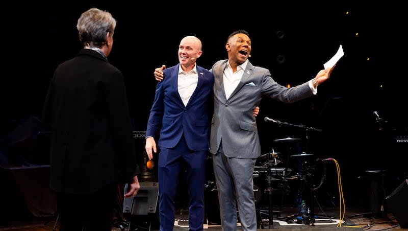 From left, Utah Gov. Spencer Cox and Johnny C. Taylor Jr., president and CEO of SHRM, hug as they walk offstage after speaking about Cox’s "Disagree Better" initiative at Culture Builders Summit at Hale Centre Theatre in Sandy on Thursday, March 28, 2024.