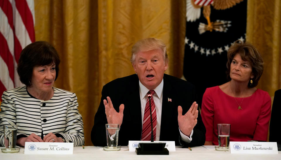 Murkowski, along with Sen. Susan Collins of Maine, sitting next to President Donald Trump in a June White House meeting where he's pressuring Republicans to repeal Obamacare. The two women didn't budge in opposing the effort. (Photo: Kevin Lamarque / Reuters)