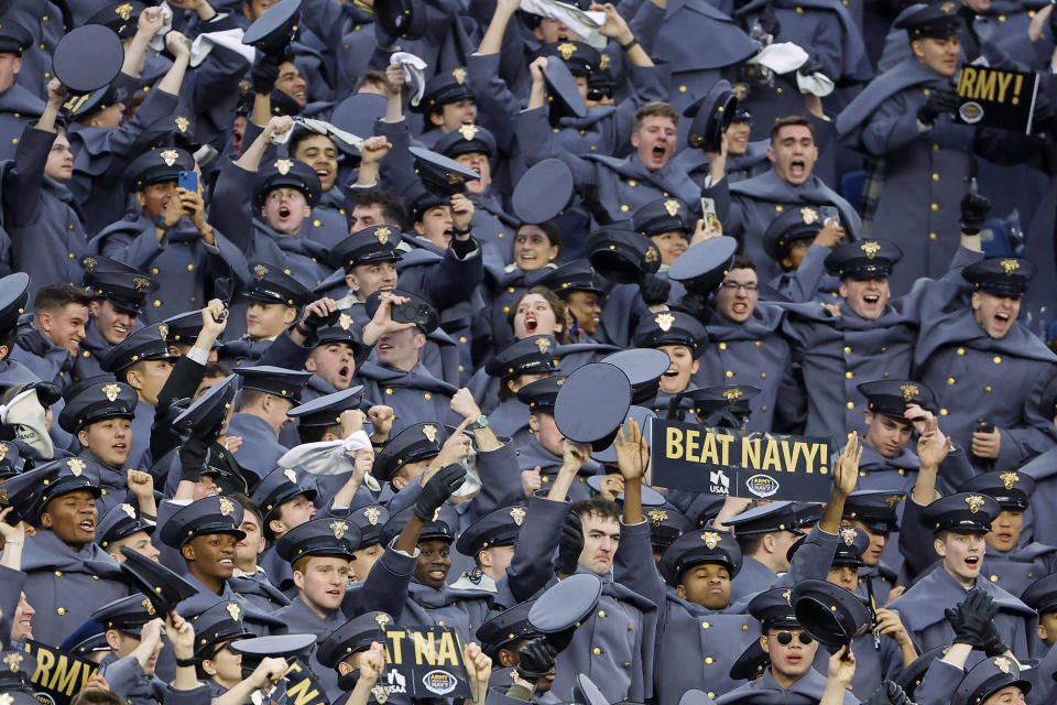 Army cadets celebrate a touchdown by the team against Navy during the second quarter of an NCAA football game Saturday, Dec. 9, 2023, in Foxborough, Mass. (AP Photo/Winslow Townson)