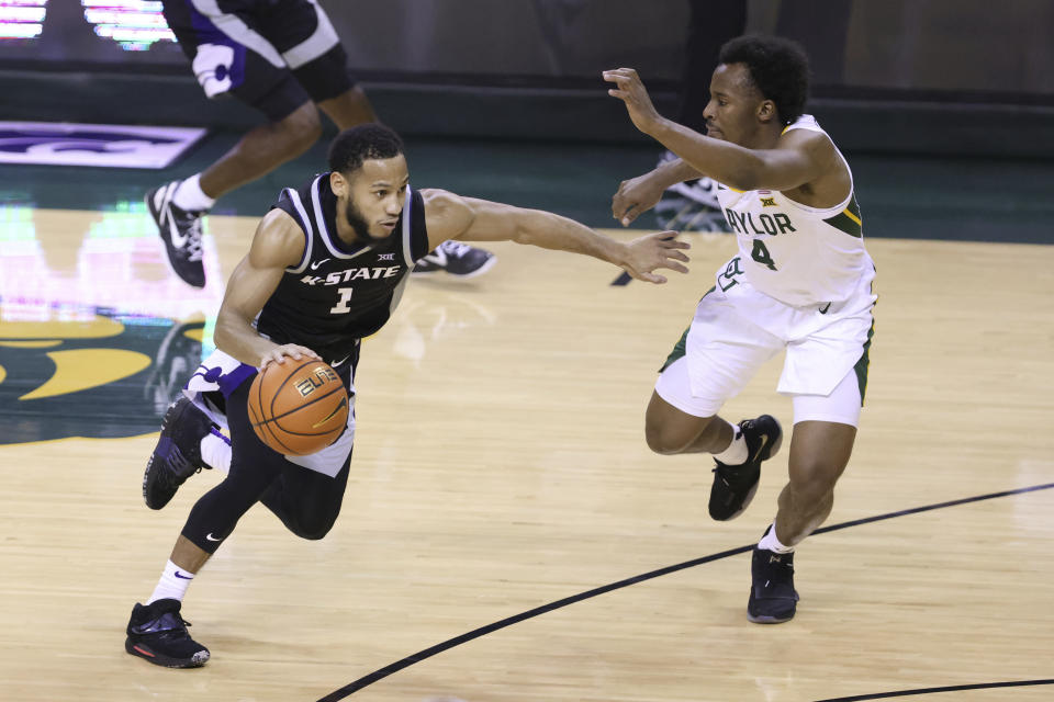 Kansas State guard Markquis Nowell (1) drives to the basket against Baylor guard LJ Cryer (4) in the second half of an NCAA college basketball game, Saturday, Jan. 7, 2023, in Waco, Texas. (AP Photo/Rod Aydelotte)