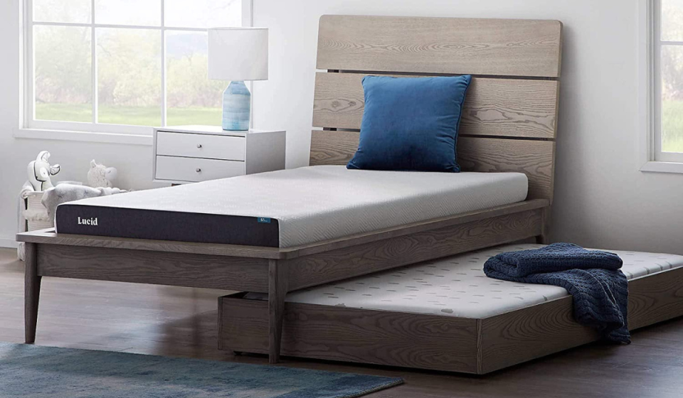 lucid mattress on a bed and one underneath