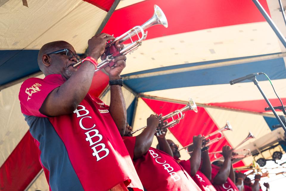 The Bayou City Brass Band plays a set at the Juneteenth Festival at Water's Edge Park on June 18, 2022. Hundreds of people came to listen to live music, visit food trucks, play games and access services.