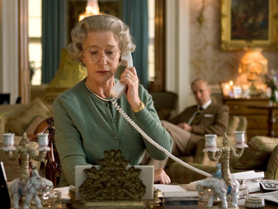 Helen Mirren as Queen Elizabeth talking on the phone