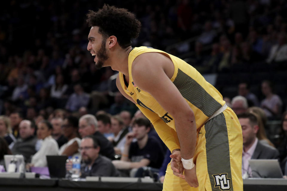 Marquette guard Markus Howard grabs at his wrist during the first half of an NCAA college basketball semifinal game against Seton Hall in the Big East men's tournament, Friday, March 15, 2019, in New York. (AP Photo/Julio Cortez)