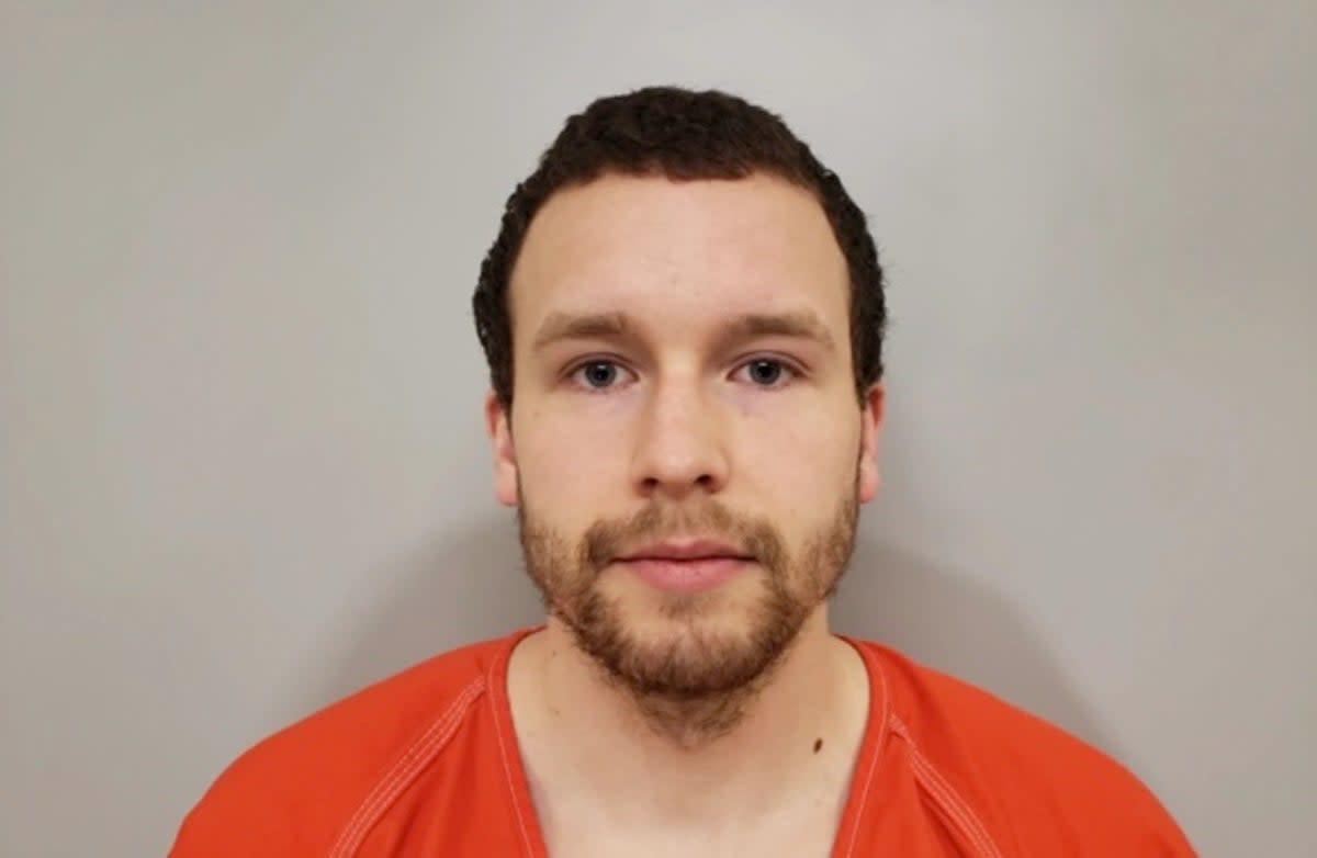 Levi Axtell, 27, (pictured in mugshot) allegedly beat Lawrence Scully, 77, more than a dozen times with a shovel before he ‘finished’ him off with the large pair of antlers (Cook County Sheriff’s Office)