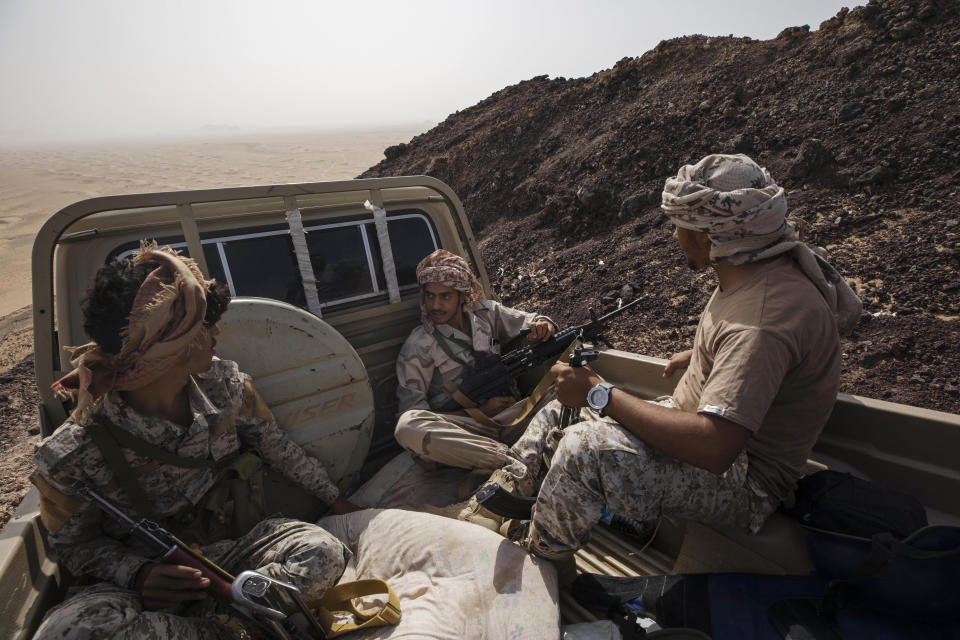 Yemeni fighters backed by the Saudi-led coalition ride in a truck on the Kassara frontline near Marib, Yemen, Sunday, June 20, 2021. (AP Photo/Nariman El-Mofty)