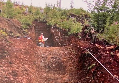 Geologist Sampling Massive Sulphide Zone in Trench B