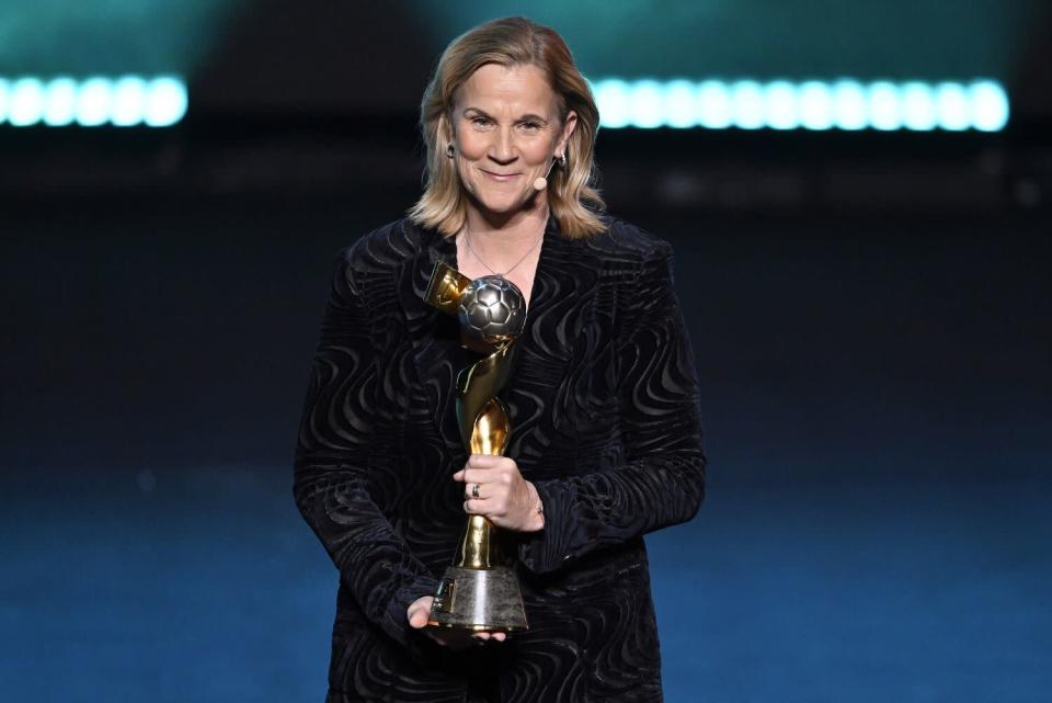 Former United States coach Jill Ellis with the trophy during the Women's World Cup draw on Saturday.