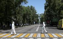 Kazakh law enforcement officers stand guard during an opposition rally in Almaty