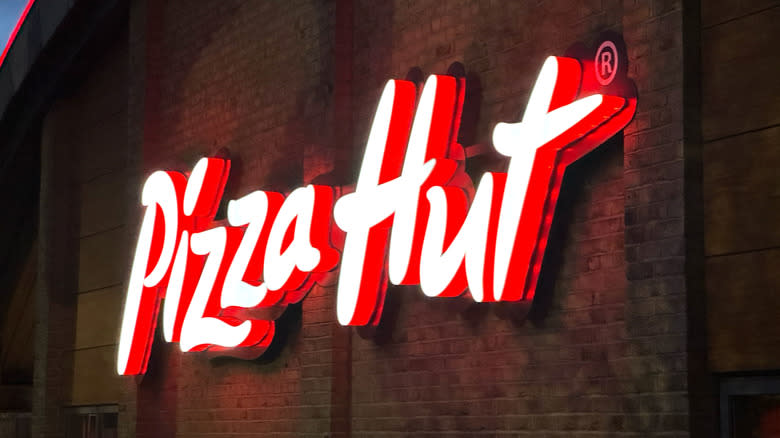 Pizza hut sign at night