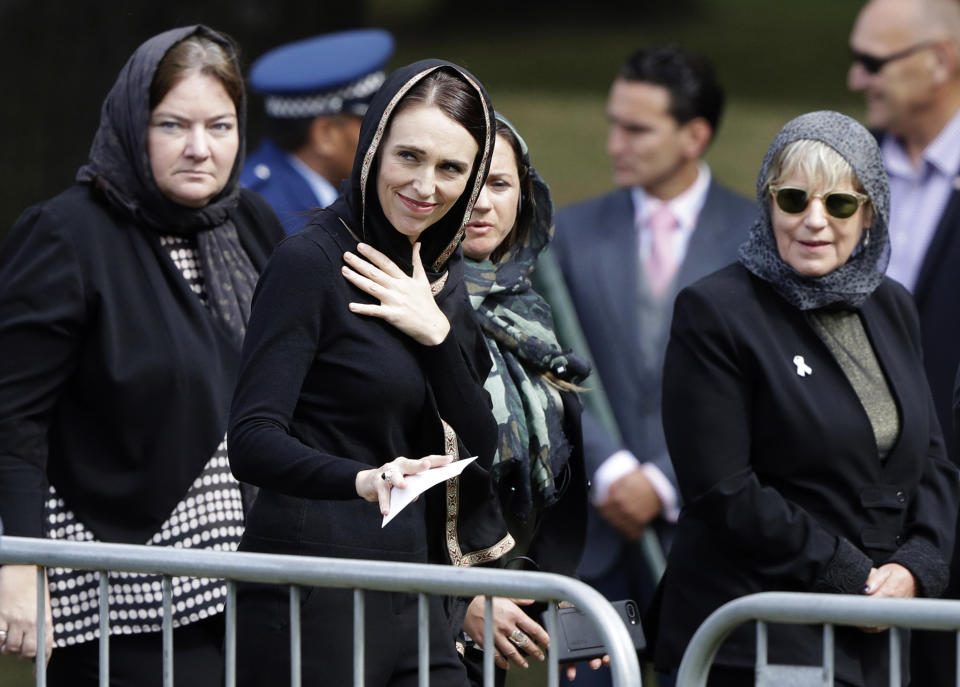 New Zealand Prime Minister Jacinda Ardern, center, leaves Friday prayers at Hagley Park in Christchurch, New Zealand, Friday, March 22, 2019. People across New Zealand are observing the Muslim call to prayer as the nation reflects on the moment one week ago when 50 people were slaughtered at two mosques. (AP Photo/Mark Baker)