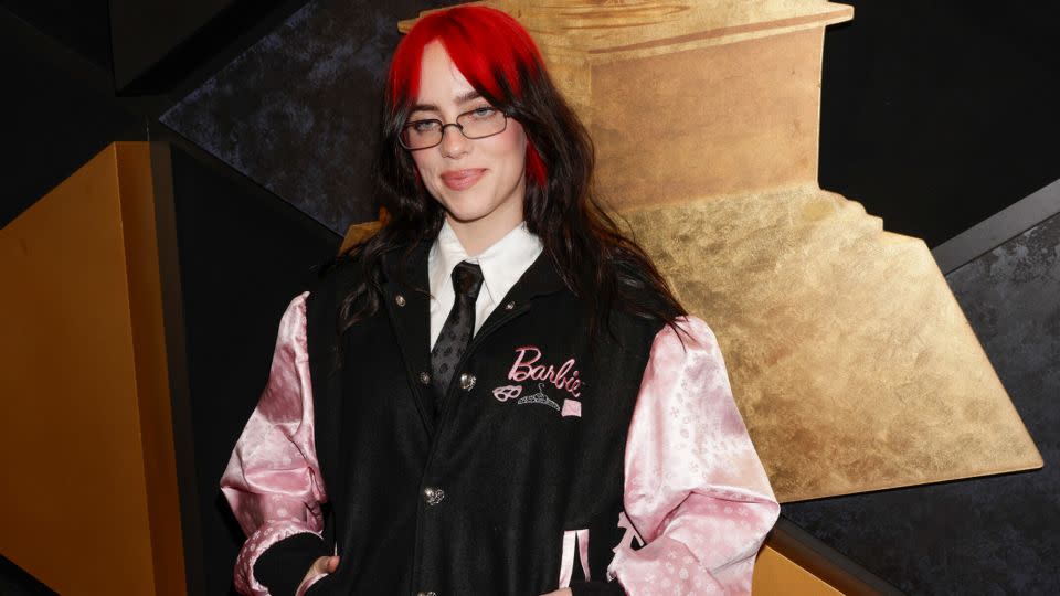 Billie Eilish, who shares a stylist with Margot Robbie, arrived in a Barbie varsity jacket by Chrome Hearts. - Francis Specker/CBS Entertainment