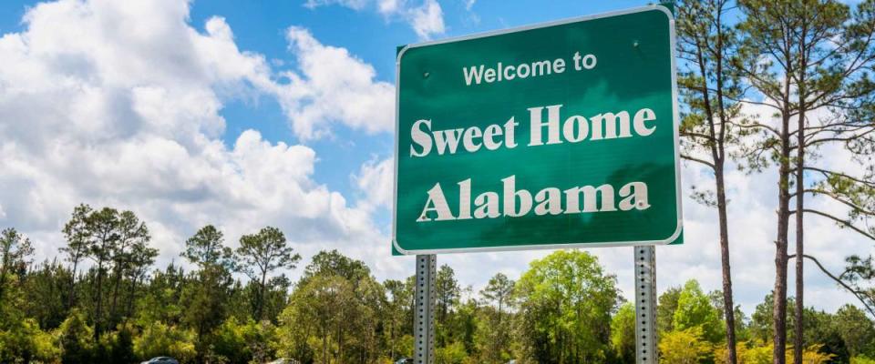 Welcome to Sweet Home Alabama Road Sign along Interstate 10 in Robertsdale, Alabama USA, near the State Border with Florida