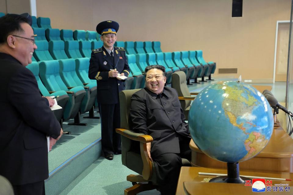 Kim Jong-un prepares for the operation of the reconnaissance satellite during his visit to the Pyongyang General Control Center at the State Aeronautics and Space Technology Directorate in Pyongyang on November 24 (KCNA VIA KNS/AFP via Getty Image)