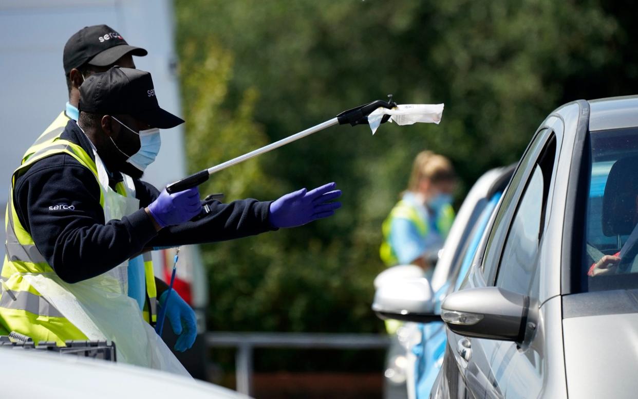 Serco staff working on behalf of NHS Test and Trace operate a coronavirus testing centre  - Getty Images Europe