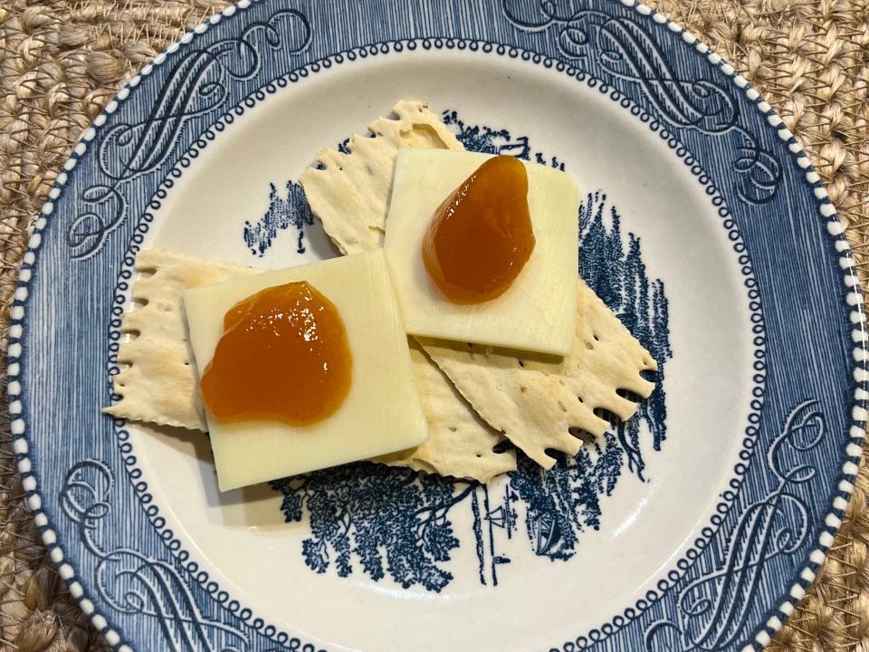 Specially Selected rosemary crackers with cheese and jam