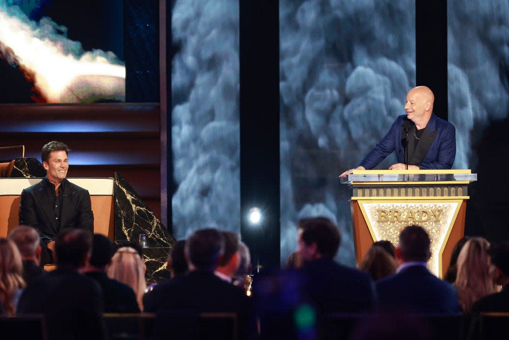 Tom Brady (left) and Jeff Ross (right) on stage during Netflix's "The Greatest Roast of All Time: Tom Brady"