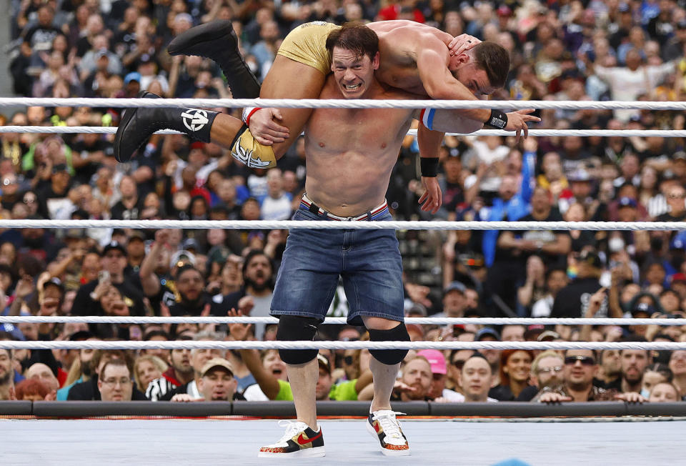 Austin Theory and John Cena at WrestleMania in 2023. (Ronald Martinez / Getty Images)