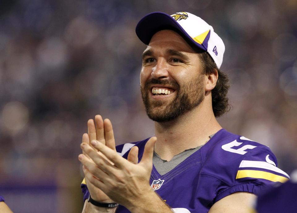 FILE - In this Aug. 29, 2013, file photo, Minnesota Vikings defensive end Jared Allen laughs on the sideline during the second half of an NFL preseason football game against the Tennessee Titans in Minneapolis. The Chicago Bears replaced one accomplished veteran pass rusher with another Wednesday, March 26, 2014, when they agreed to terms with Allen on a four-year contract. A person with knowledge of the agreement told The Associated Press that Allen will get $15.5 million guaranteed on a deal that could be worth as much as $32 million. The person requested anonymity because the terms have not been announced. (AP Photo/Ann Heisenfelt, File)