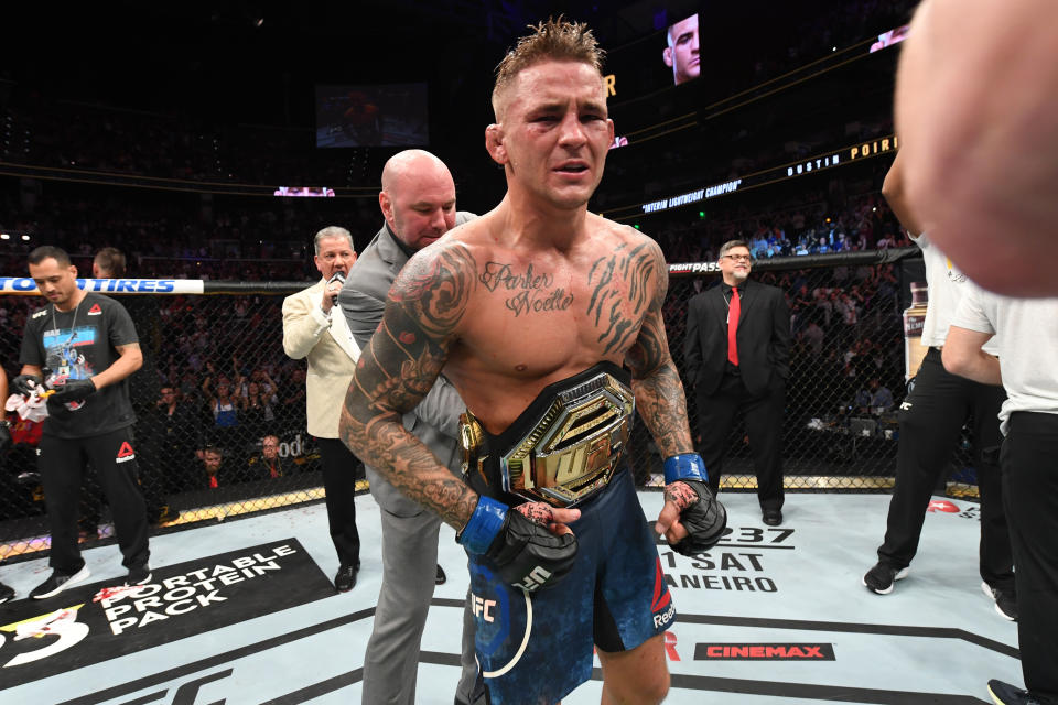 ATLANTA, GA - APRIL 13:  (L-R) UFC President Dana White places the interim lightweight championship belt on Dustin Poirier after defeating Max Holloway in their interim lightweight championship bout during the UFC 236 event at State Farm Arena on April 13, 2019 in Atlanta, Georgia. (Photo by Josh Hedges/Zuffa LLC/Zuffa LLC via Getty Images)