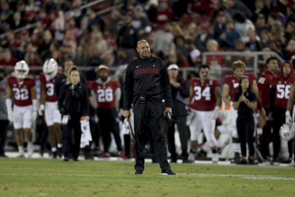 Stanford coach David Shaw stands on the field against during the first half of the team's NCAA college football game against Notre Dame in Stanford, Calif., Saturday, Nov. 27, 2021. (AP Photo/Jed Jacobsohn)