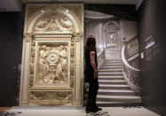 A visitor looks at a picture of the grand staircase at the museum's Titanic exhibition on April 3, 2012 in Southampton, England. The new SeaCity Museum, which will open at 1.30pm on April 10, 100 years to the day since the Titanic set sail from the city. The museum, which cost 15 GBP million, promises to tell the largely untold story of Southampton's Titanic crew and the impact the tragedy had on the city, as well as featuring other aspects of the city's seafaring past. (Photo by Matt Cardy/Getty Images)