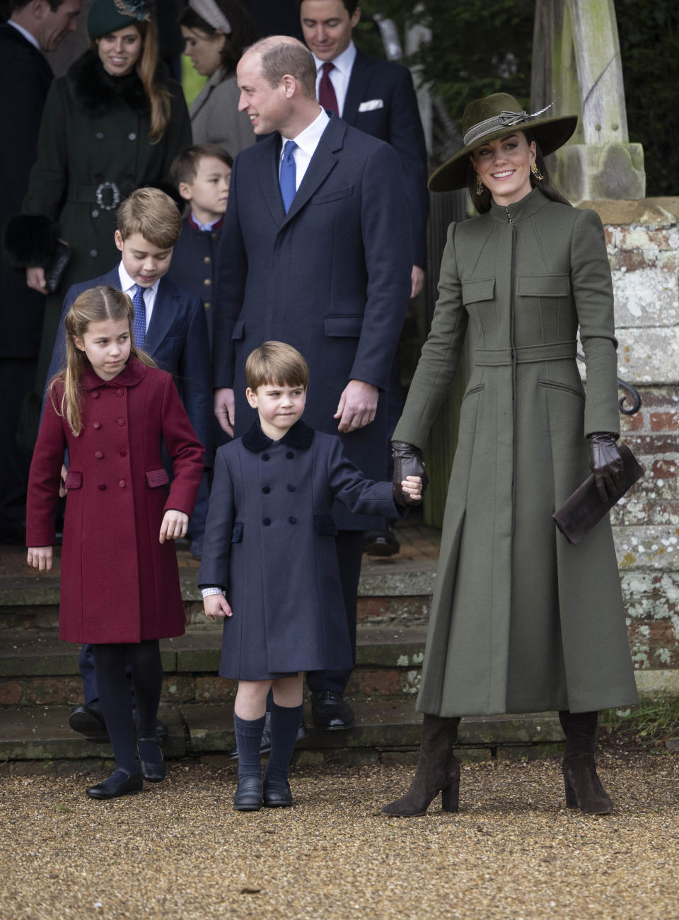 Prince William, Prince of Wales and Catherine, Princess of Wales with Prince George of Wales, Princess Charlotte of Wales and Prince Louis of Wales attend the Christmas Day service at St Mary Magdalene Church 