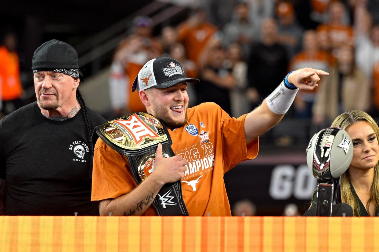 Quarterback Quinn Ewers received a championship belt from wrestling legend the Undertaker after leading Texas to a Big 12 title in 2023. The Horns start spring football Tuesday after a 12-2 finish and their first College Football Playoff appearance.