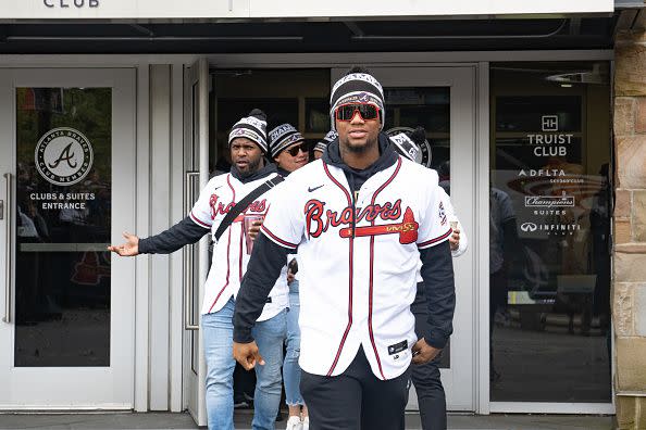 ATLANTA, GA - NOVEMBER 05: Fans cheer for Ronald Acuña Jr. of the Atlanta Braves as he gets on the buses before their World Series Parade at Truist Park on November 5, 2021 in Atlanta, Georgia. The Atlanta Braves won the World Series in six games against the Houston Astros winning their first championship since 1995. (Photo by Megan Varner/Getty Images)