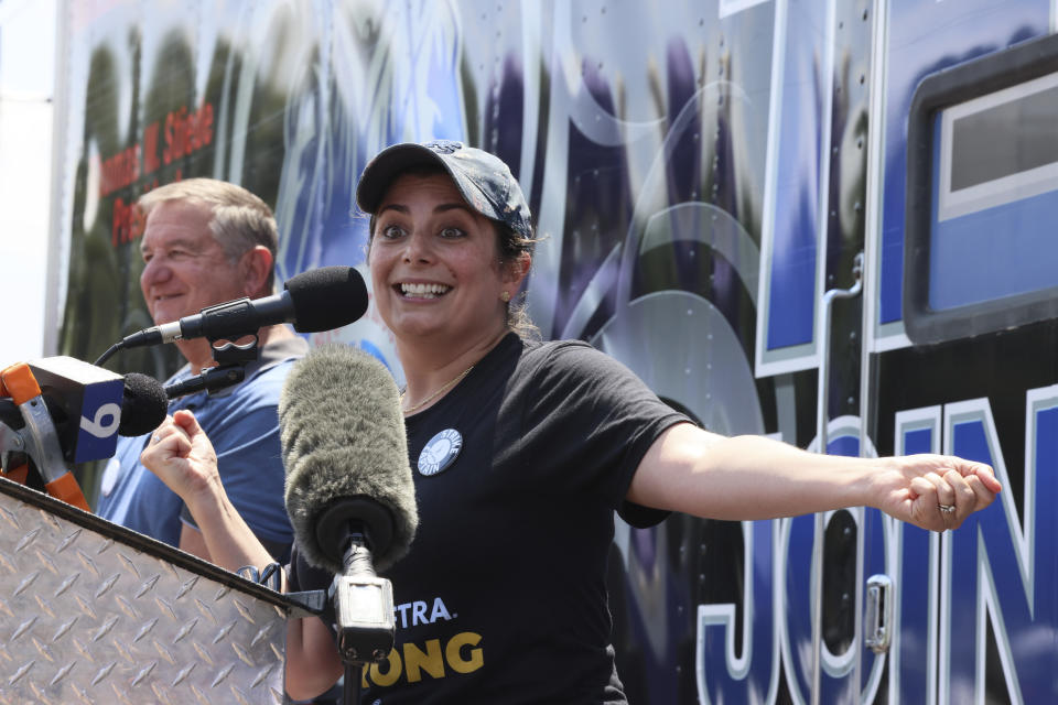 Courtney Rioux, an actor in "Chicago Med," speaks to striking screenwriters and actors at a rally in Chicago Thursday, July 20, 2023, as the labor dispute that has halted Hollywood spreads to more cities. (AP Photo/Teresa Crawford)