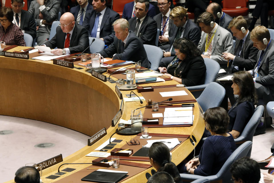 Russia's U.N. Ambassador Vassily Nebenzia, upper left, addresses the United Nations Security Council, as U.S. Ambassador Nikki Haley, right, listens at U.N. headquarters, Monday, Sept. 17, 2018. (AP Photo/Richard Drew)