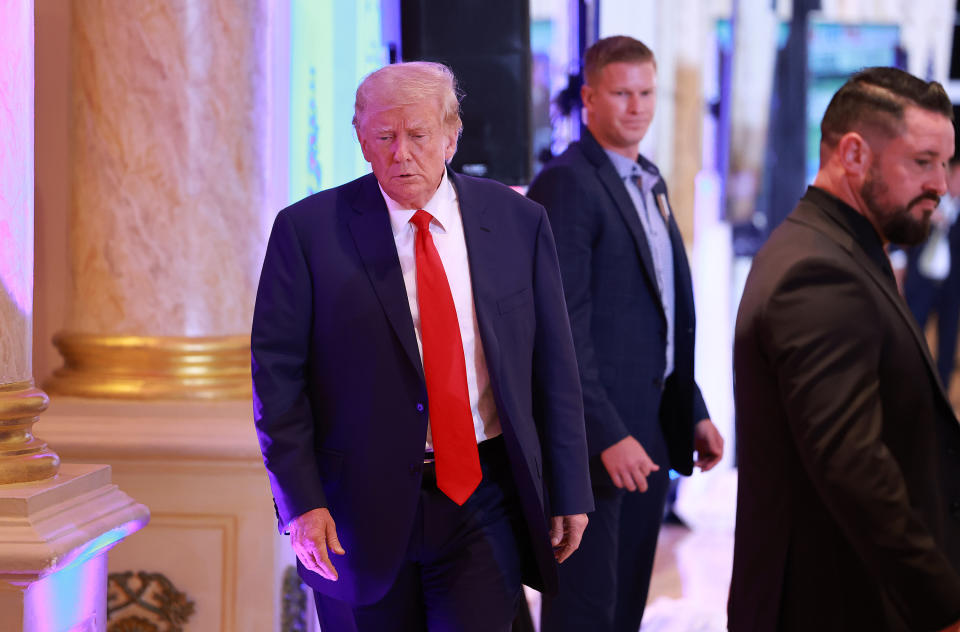 Former President Donald Trump is seen inside Mar-a-Lago walking to meet with the media.