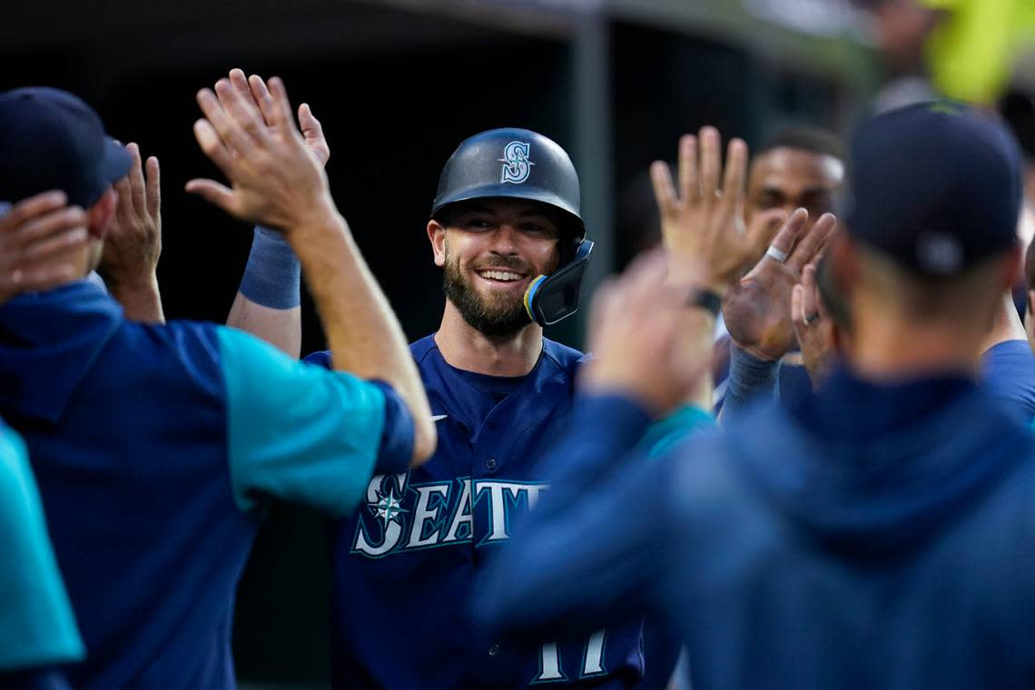 Seattle Mariners’ Mitch Haniger celebrates scoring against the Detroit Tigers in the third inning of a baseball game in Detroit, Tuesday, Aug. 30, 2022. (AP Photo/Paul Sancya)