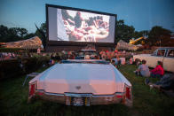 <p>People attend a screening of filmmaker Julian Temple’s Glastonbury documentary being shown at the new night time area, Cinemaggedon at the Glastonbury Festival at Worthy Farm in Pilton on June 21, 2017 near Glastonbury, England. (Photo: Matt Cardy/Getty Images) </p>