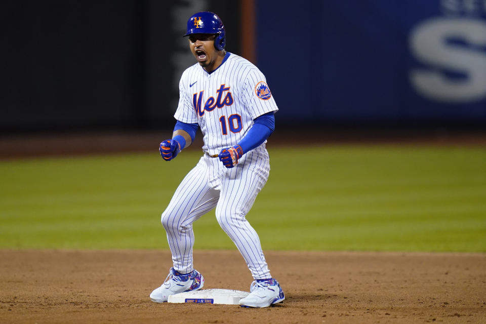 New York Mets' Eduardo Escobar celebrates after hitting a double against the New York Yankees during the ninth inning of a baseball game Wednesday, July 27, 2022, in New York. The Mets won 3-2. (AP Photo/Frank Franklin II)