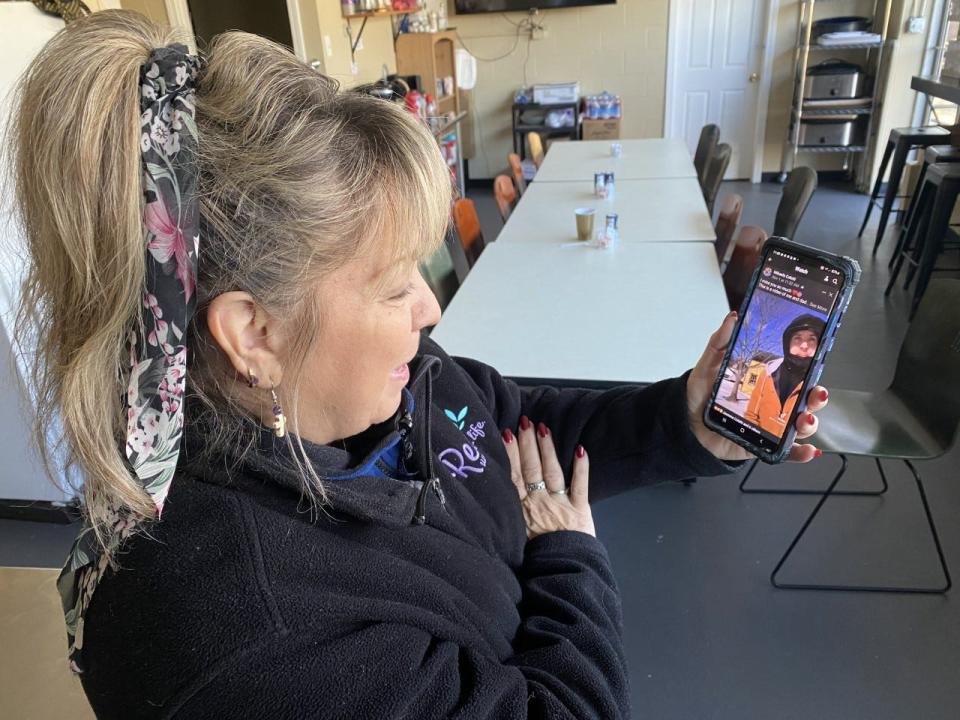 Anna Randall watching a video of her son Chris Coletti, 35, teach his daughter to ice skate. Coletti was fatally shot Nov. 1, and Randall said she is hoping he alleged shooting is charged with murder.