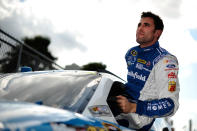 DAYTONA BEACH, FL - FEBRUARY 19: Aric Almirola, driver of the #43 Smithfield Ford, gets out of his car during qualifying for the NASCAR Sprint Cup Series Daytona 500 at Daytona International Speedway on February 19, 2012 in Daytona Beach, Florida. (Photo by Jared C. Tilton/Getty Images for NASCAR)