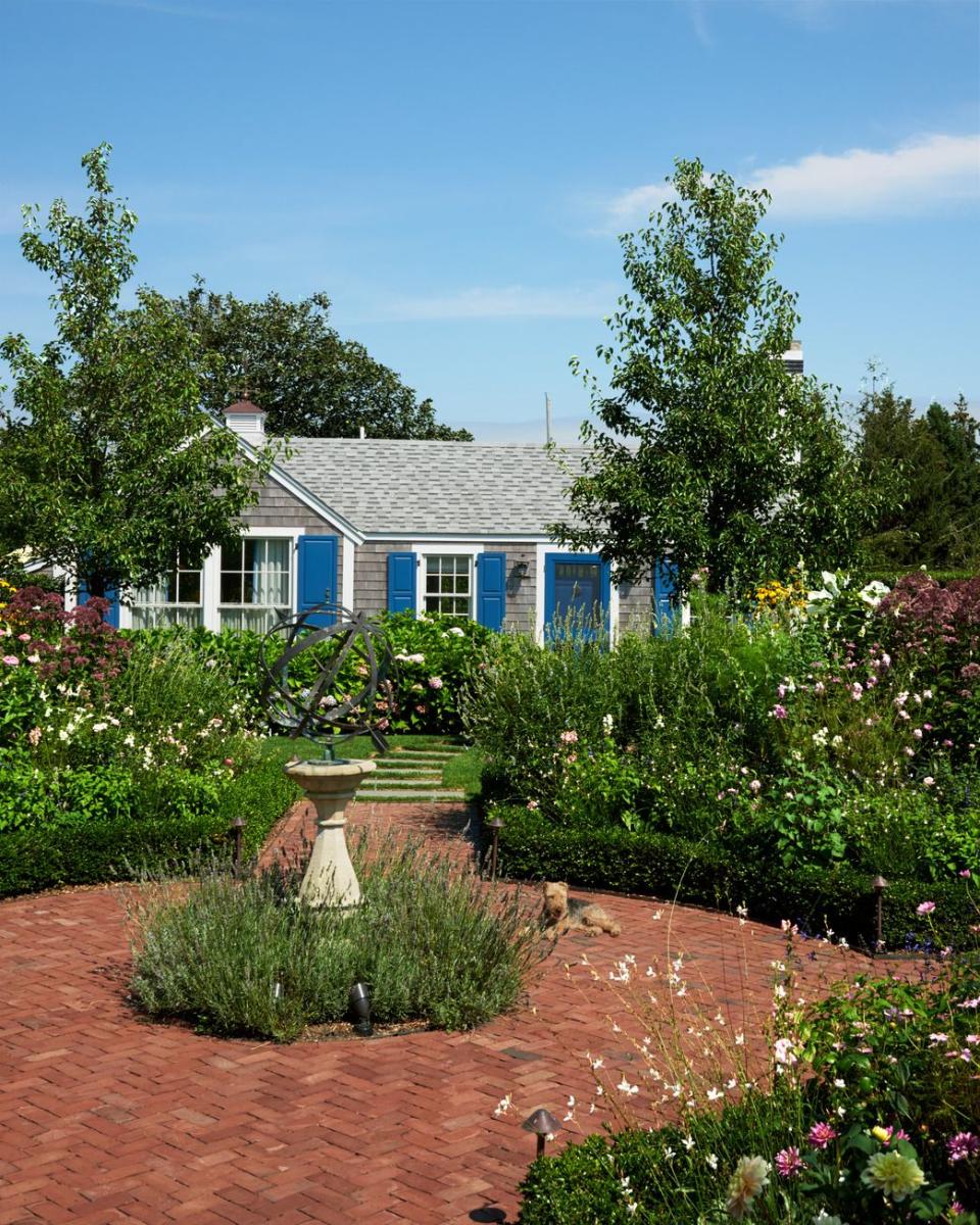 a house with a garden and a large front yard