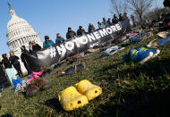 <p>7,000 empty pairs of shoes for every child killed by guns in the US since Sandy Hook cover the southeast lawn of U.S. Capitol Building on Tuesday, March 13, 2018 in Washington. (Photo: Paul Morigi/AP Images for AVAAZ) </p>