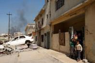 Smoke rises from the old city during a battle against Islamic State militants, in Mosul, Iraq, March 26, 2017. REUTERS/Youssef Boudlal