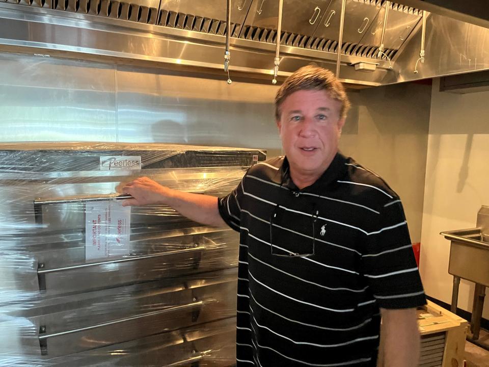 Tom Courtney in the cooking area of the new TJ's Pizza & Wine that will open at The City Center in Mt. Juliet.