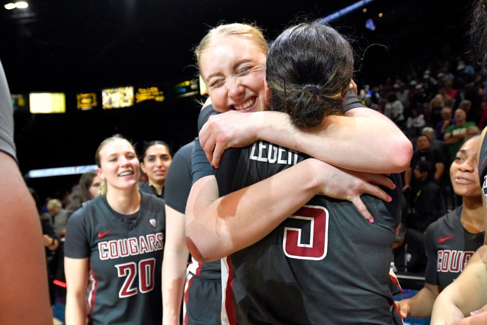 Washington State's Tara Wallack hugs teammate Charlisse Leger-Walker after the team defeated UCLA in  the Pac-12 women's tournament championship.