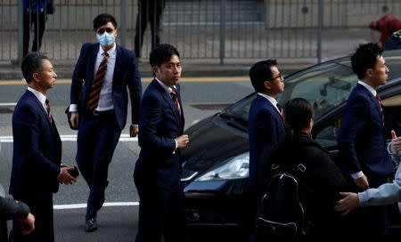 Five of the seven police officers (L-R) Chief Inspector Wong Cho-sing, Police Constable Chan Siu-tan, Police Constable Kwan Ka-ho, Sergeant Pak Wing-bun and Senior Inspector Lau Cheuk-ngai, charged in connection with the beating of a protester during Occupy Central pro-democracy demonstrations, arrive at a court in Hong Kong, China February 14, 2017. REUTERS/Bobby Yip