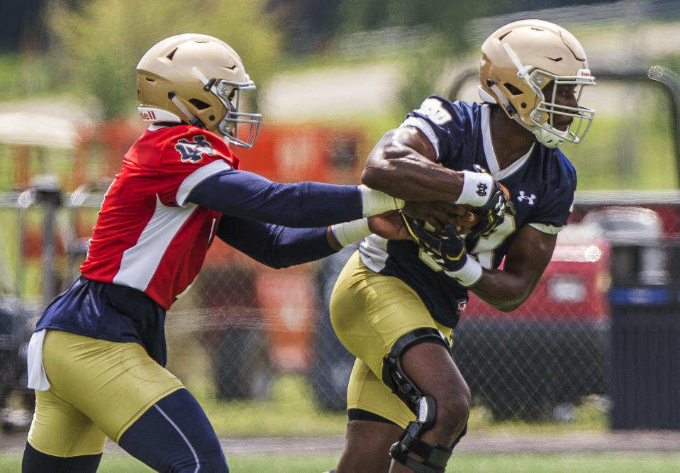 Brandon Wimbush, left, and running back Josh Adams, right will be a nice backfield duo for Notre Dame. (Robert Franklin/South Bend Tribune via AP)